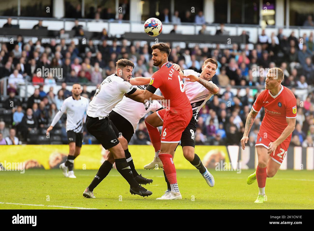 Ryan Tafazolli of Wycombe Wanderers battles in the box with Eiran Cashin of Derby County and James Collins of Derby County during the Sky Bet League 1 match between Derby County and Wycombe Wanderers at Pride Park, Derby on Saturday 17th September 2022. Stock Photo