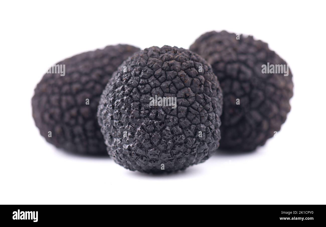 Black truffles isolated on a white background. Fresh sliced truffle. Delicacy exclusive truffle mushroom. Piquant and fragrant French delicacy. Clippi Stock Photo