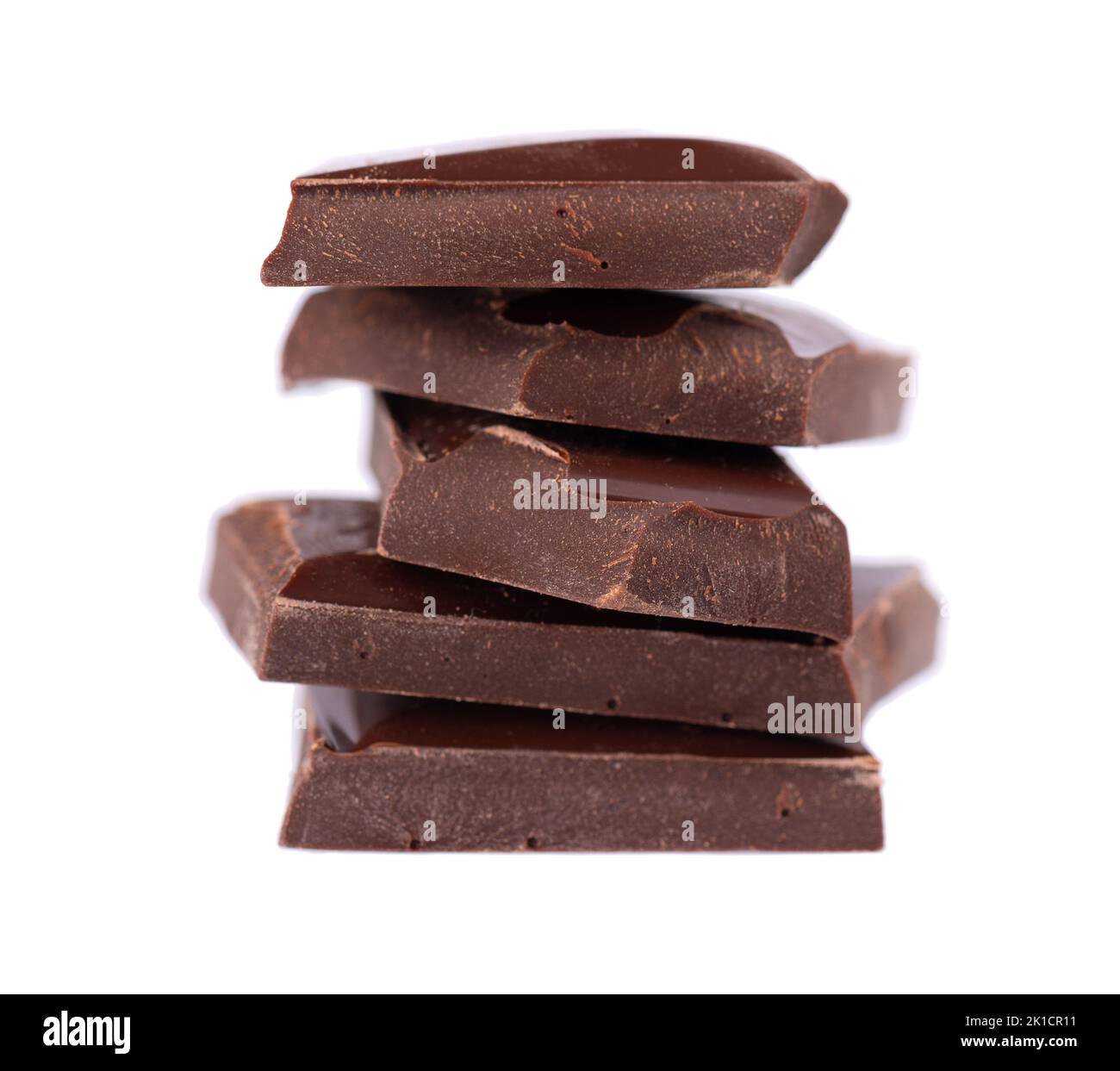 Chocolate pieces stack isolated on white background. Dark chocolate. Close up Stock Photo