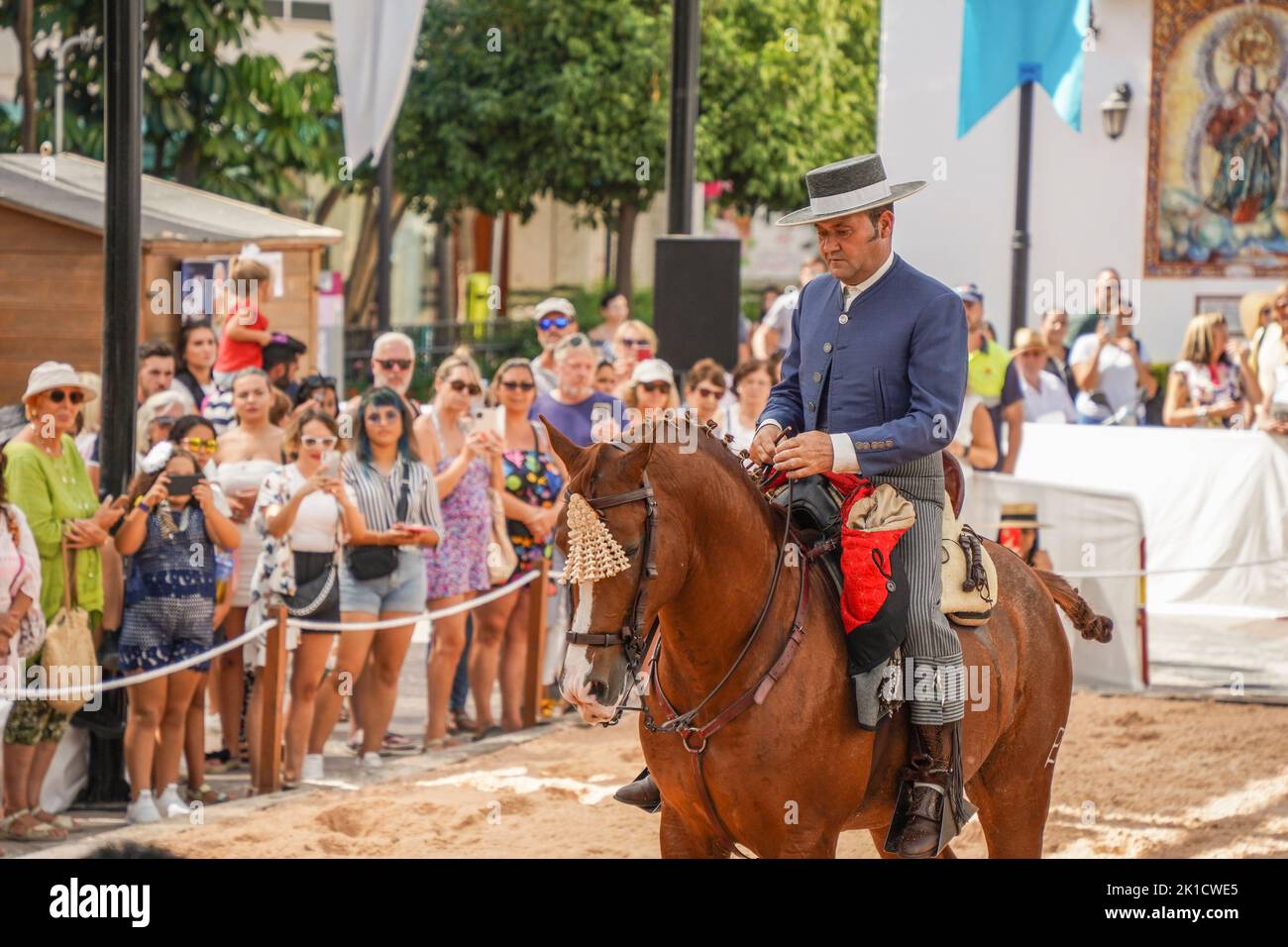 Man performing Spanish dressage horse riding show, during annual Horse day. Fuengirola, Andalusia, Costa del Sol, Spain. Stock Photo