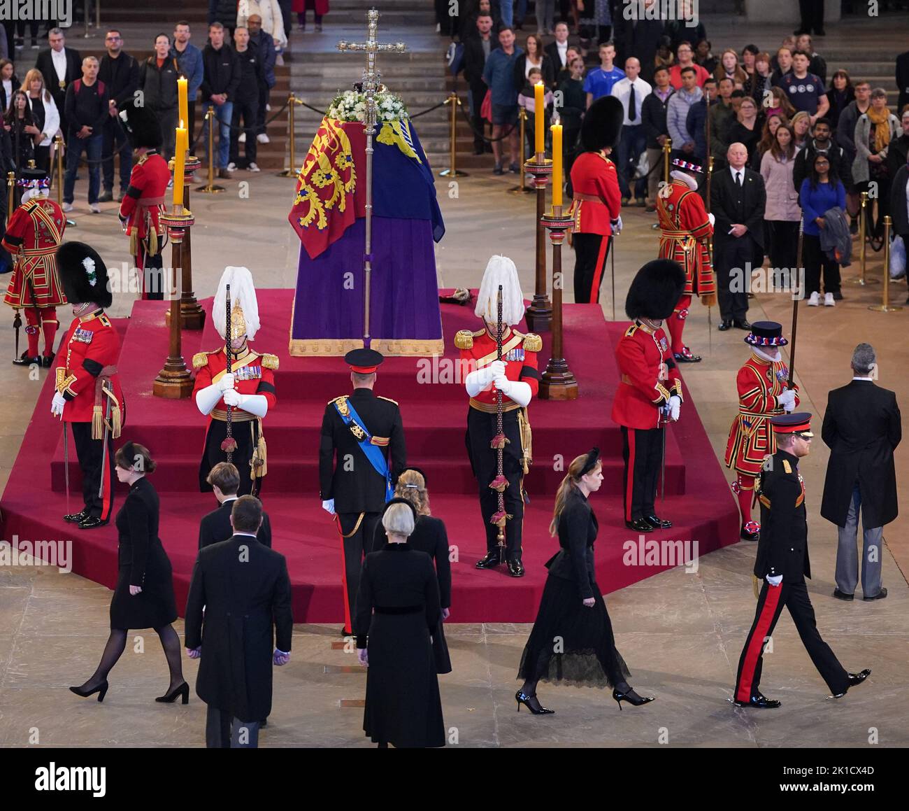 Queen Elizabeth II 's grandchildren (left to right) Princess Eugenie,James, Viscount Severn, Peter Phillips, the Prince of Wales, Zara Tindall, Lady Louise Windsor, Princess Beatrice, and the Duke of Sussex arrive to stand a vigil beside the coffin of their grandmother as it lies in state on the catafalque in Westminster Hall, at the Palace of Westminster, London. Picture date: Saturday September 17, 2022. Stock Photo