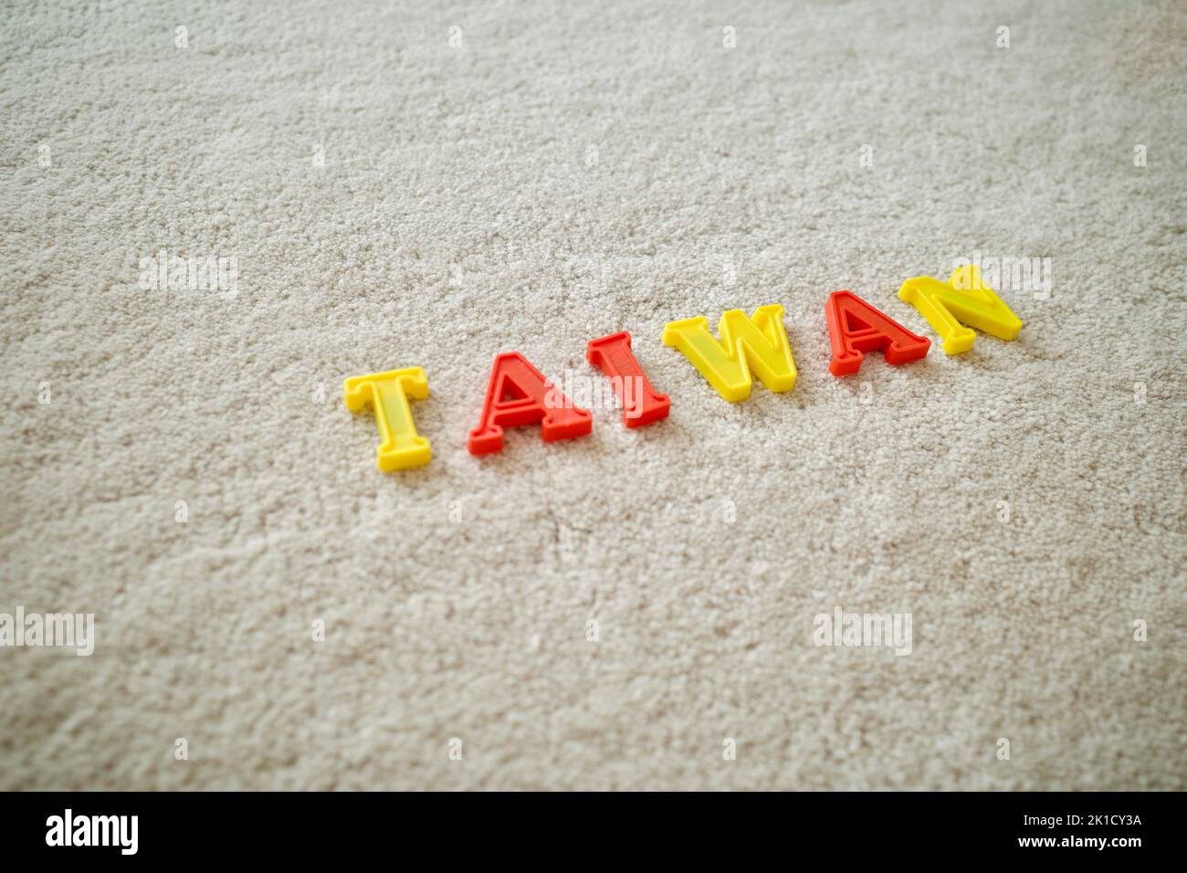 Taiwan wording spelled by yellow and red alphabet puzzles Stock Photo