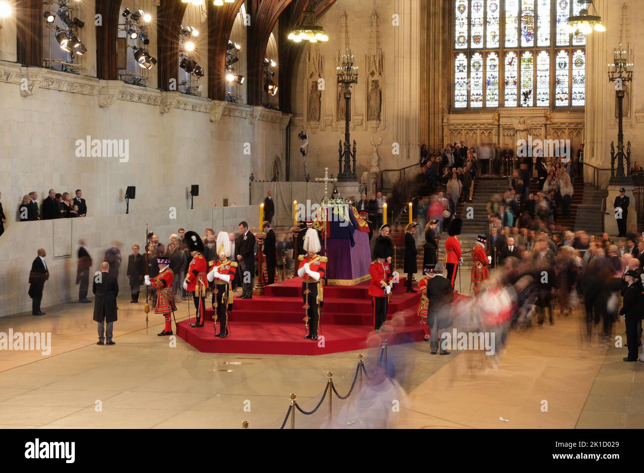 Queen Elizabeth II's grandchildren (clockwise from front centre) the Prince of Wales, Peter Phillips, James, Viscount Severn, Princess Eugenie, the Duke of Sussex, Princess Beatrice, Lady Louise Windsor and Zara Tindall hold a vigil beside the coffin of their grandmother as it lies in state on the catafalque in Westminster Hall, at the Palace of Westminster, London. Picture date: Saturday September 17, 2022. Stock Photo