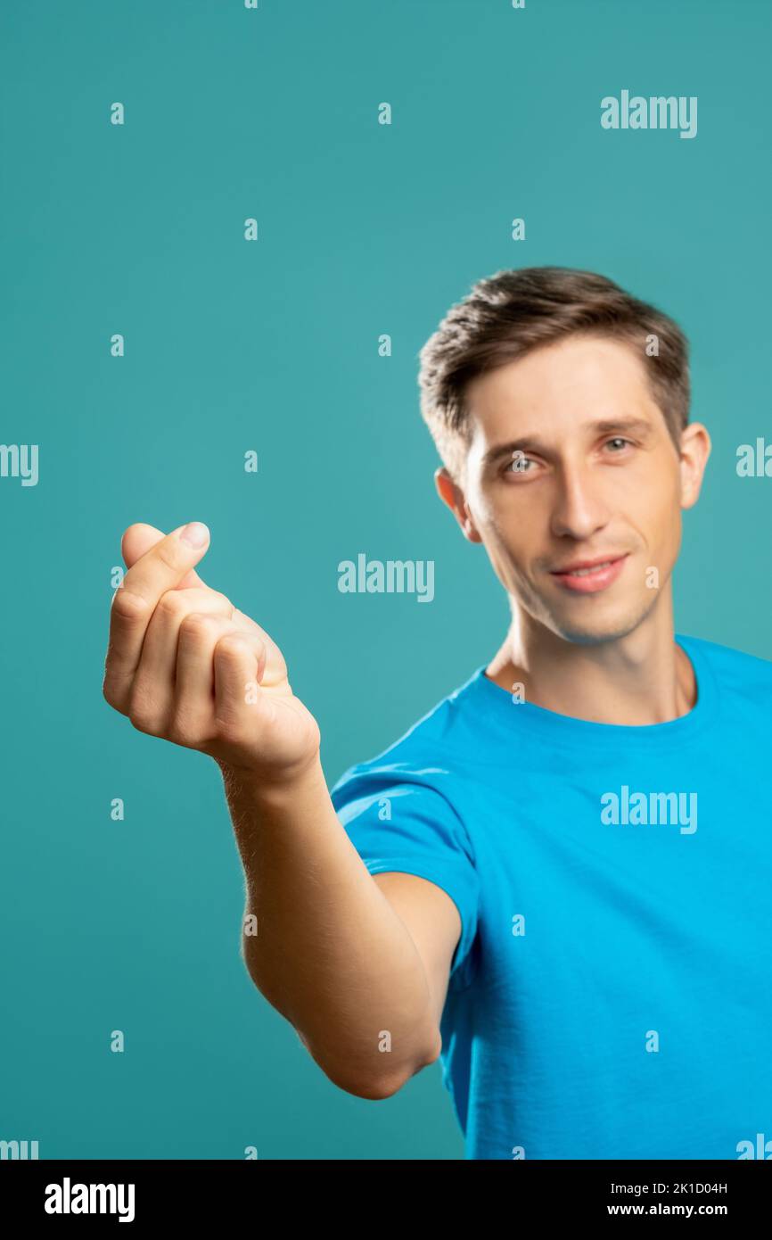 Snap fingers. Handsome male portrait. Musical rhythm. Playful gesture