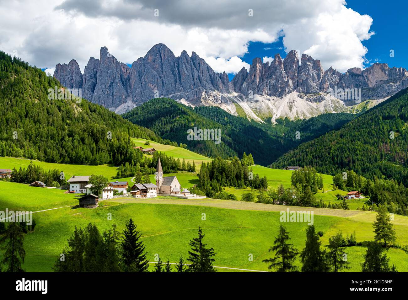 Saint Magdalena church of Villnöß (Funes) in South Tyrol in northern Italy with the iconic Gruppo delle Odle mountains of the Dolomite Alps in the bac Stock Photo
