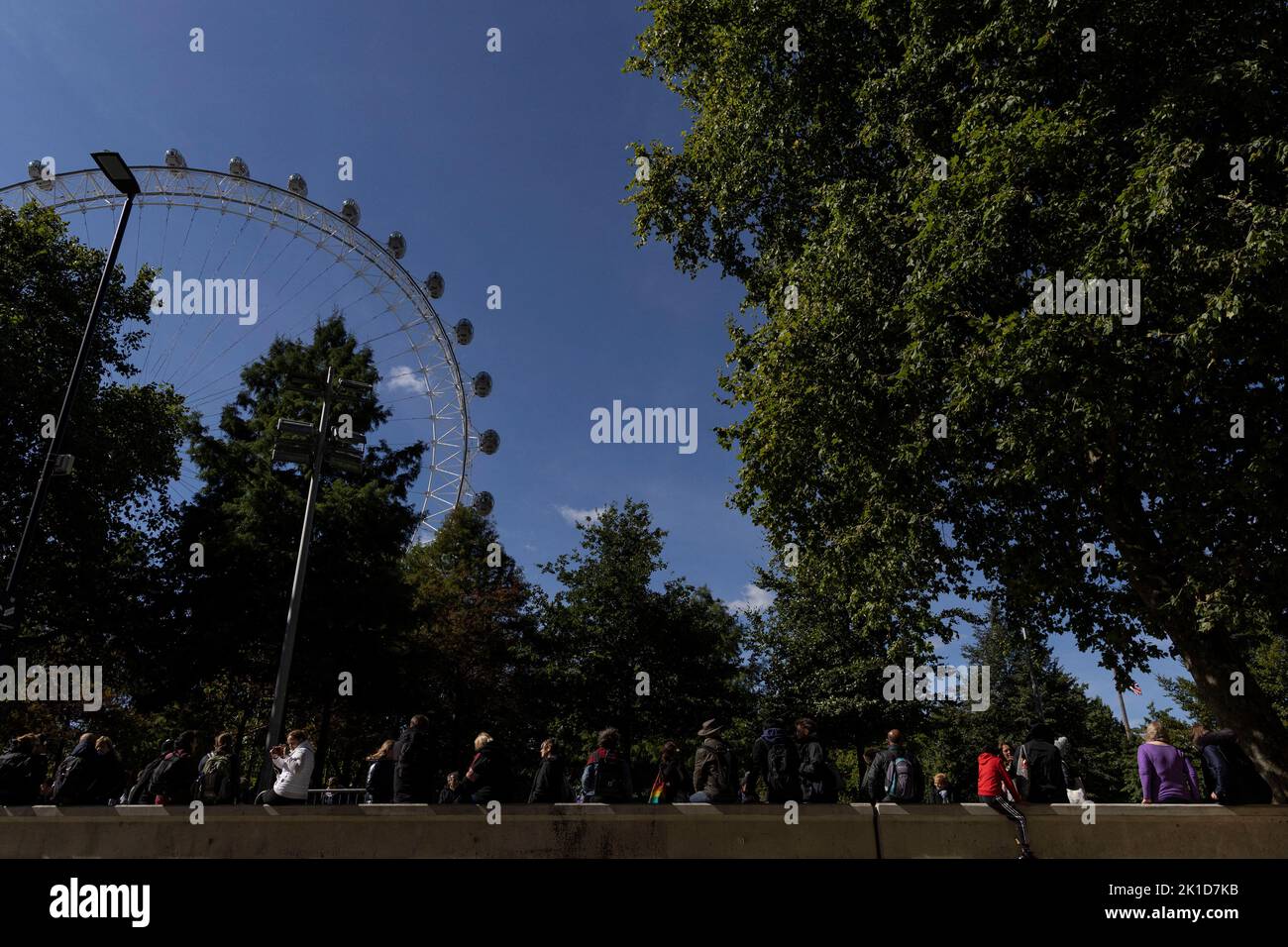 The London Eye wheel is seen as people stand in a queue to pay respect to Britain's Queen Elizabeth, following her death, in London, Britain September 17, 2022. REUTERS/Carlos Barria Stock Photo