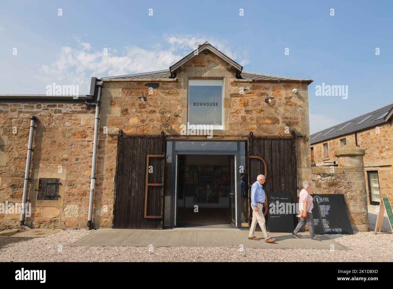 East Neuk, UK - August 14, 2022: An elderly couple visits the rural country Bowhouse Farmer's Market at East Neuk in Fife, Scotland. Stock Photo