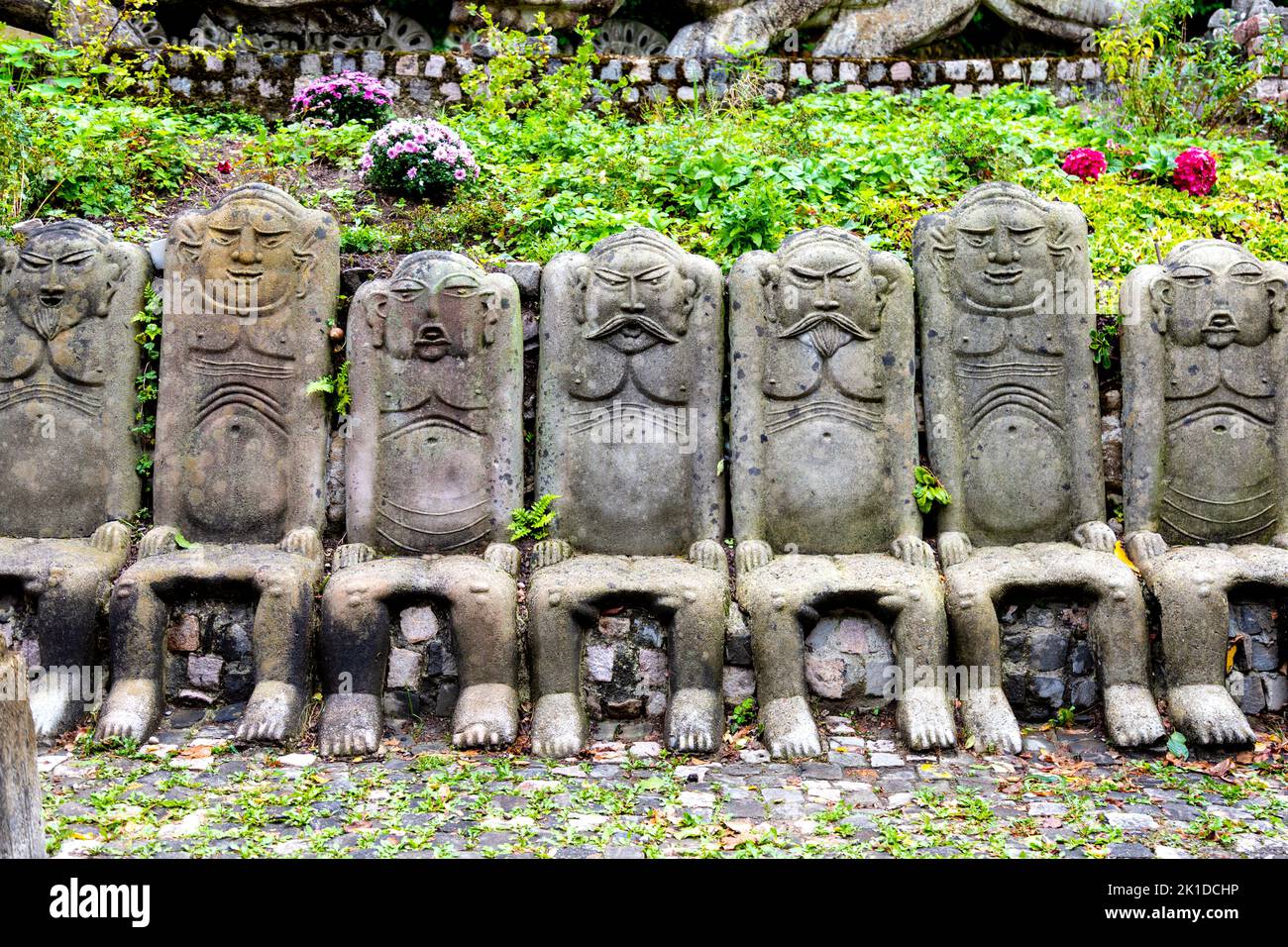 Chairs in the shape of men at Bruno Weber Park, Dietikon, Switzerland Stock Photo