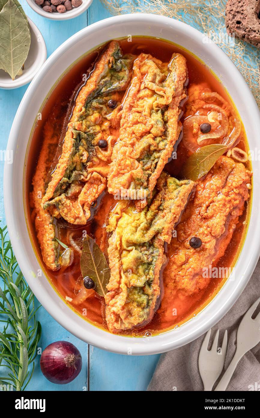 Tasty roasted mackerel marinated in vinegar with onion. Mackerel