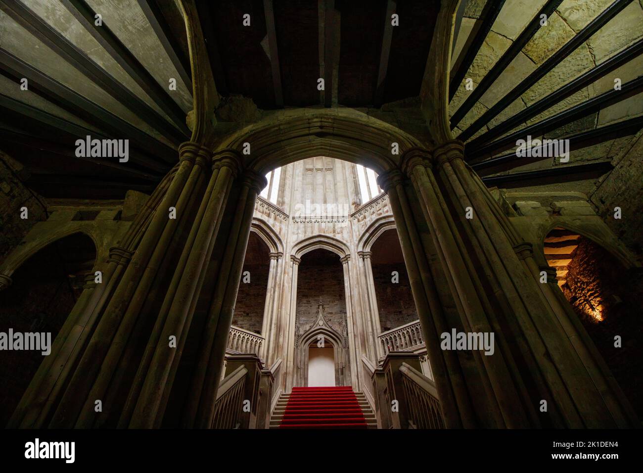 The main staircase inside Margam Castle, a Tudor Gothic mansion house built by Christopher Rice Mansel Talbot in the early nineteenth century. Stock Photo