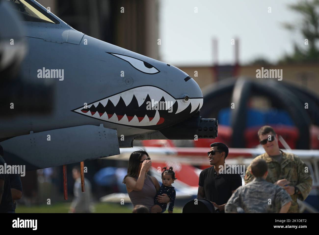 Attendees gather around an A10 Thunderbolt II during the Joint Base