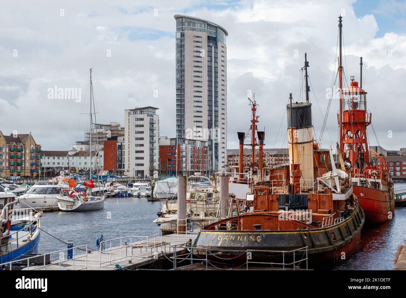 The Trinity House Lightship 91 Helwick moored along with Boats and yachts in Swansea Basin. Stock Photo
