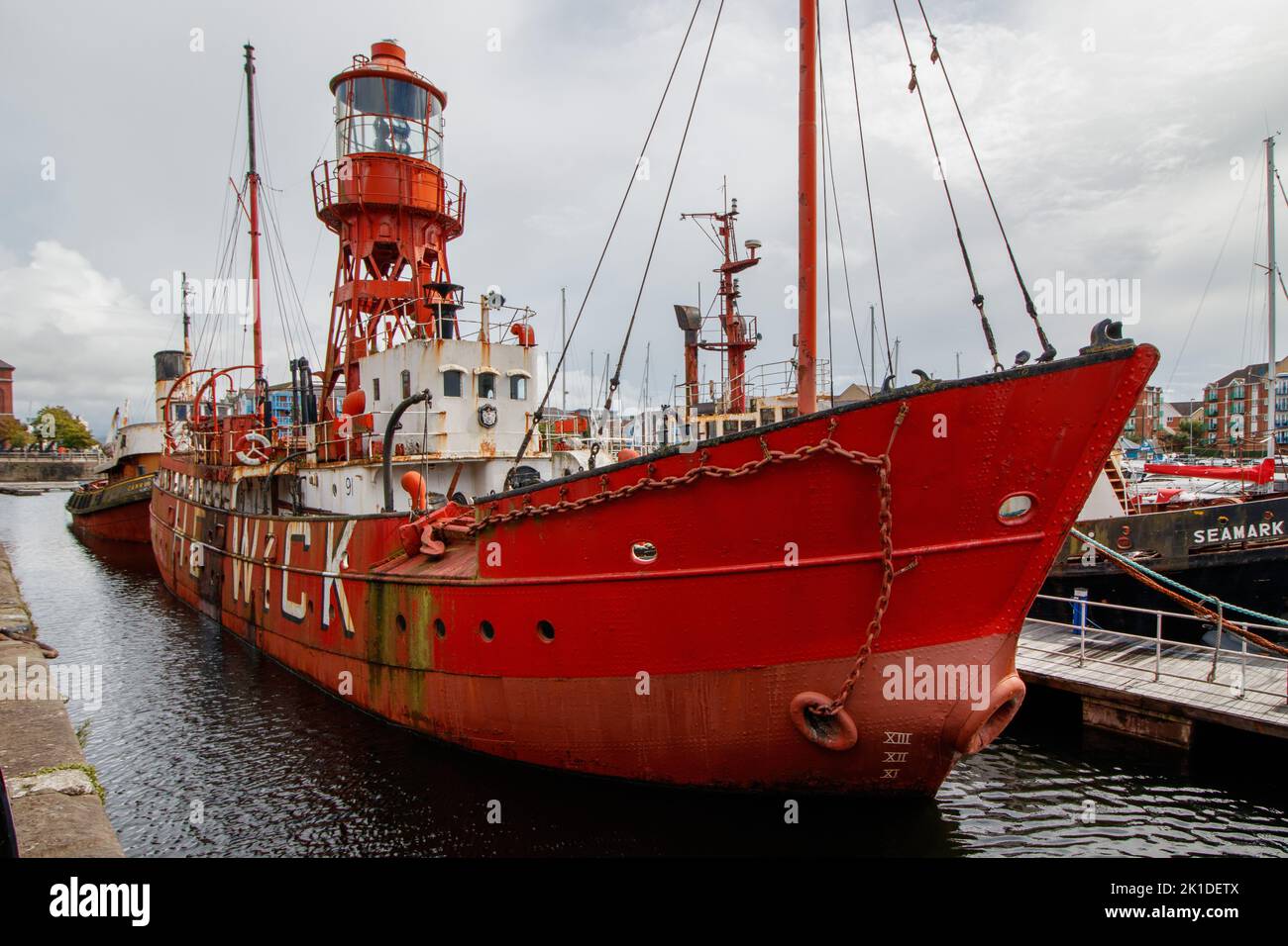 The Trinity House Lightship 91 Helwick moored along with Boats and yachts in Swansea Basin. Stock Photo