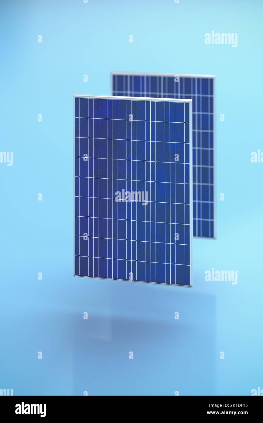 Solar energy with solar panels concept. Two solar panels hovering over a blue background. Vertical orientation, selective focus Stock Photo