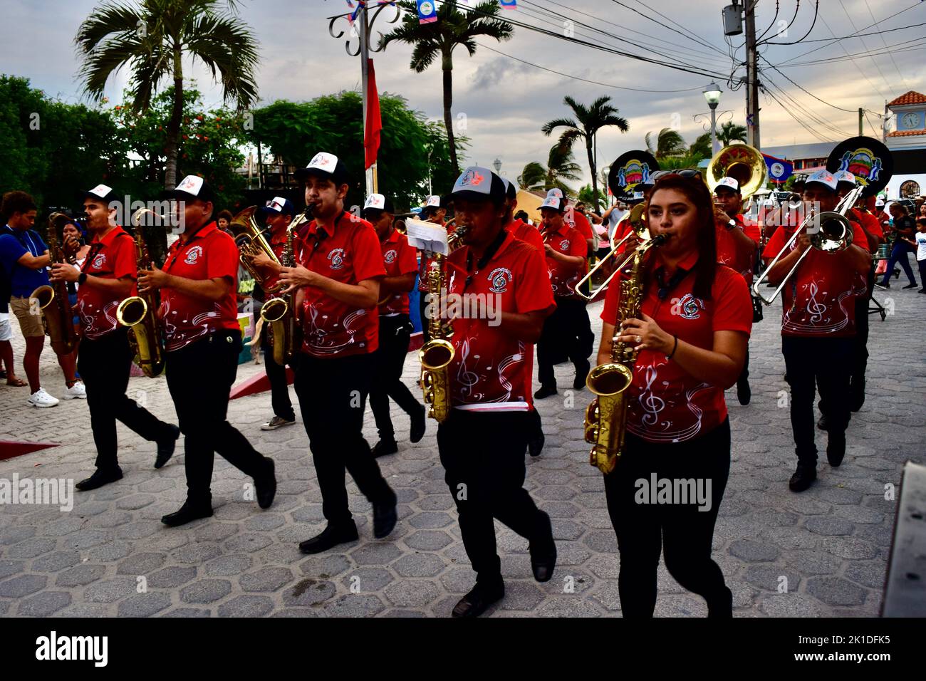 The Guayabal Latin Band Municipal, from El Salvador, marching down the streets of San Pedro, Belize performing for Noche Centroamericana. Stock Photo