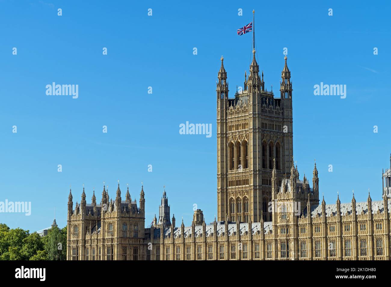 Palace of Westminster with Union Jack flag flying at half mast Stock