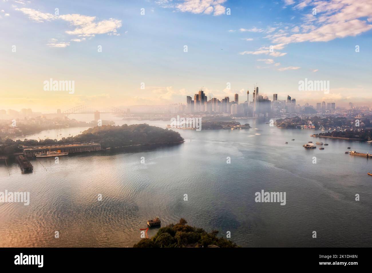 Parramatta river to Sydney Harbour around city CBD Waterfront - aerial cityscape and skyline at sunrise. Stock Photo