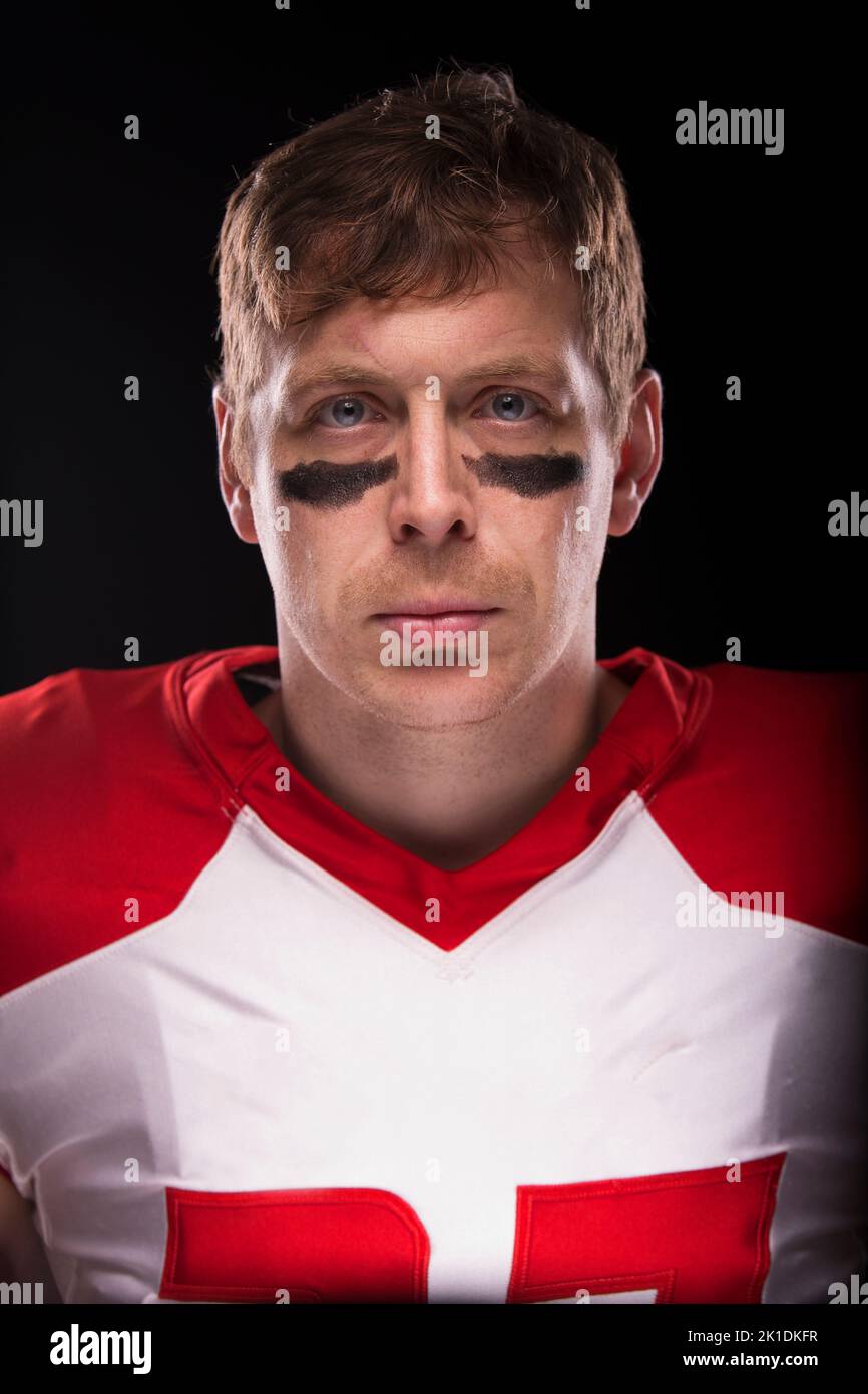 Close up headshot of a male in American football attire. Stock Photo