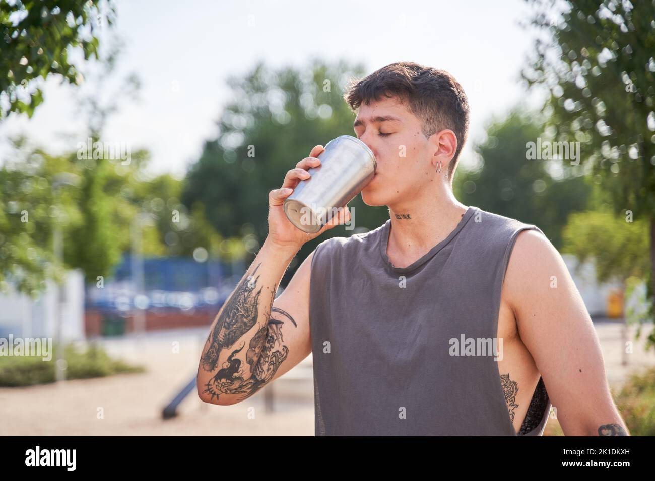 young athlete drinking water from the bottle Stock Photo