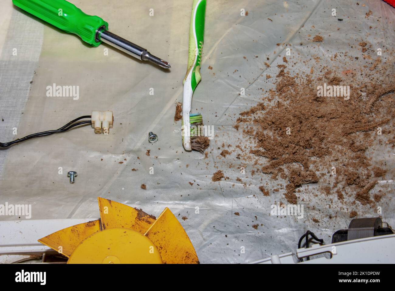 Dry dirt and dust cleaned from a kitchen exhaust fan. Closeup. Air