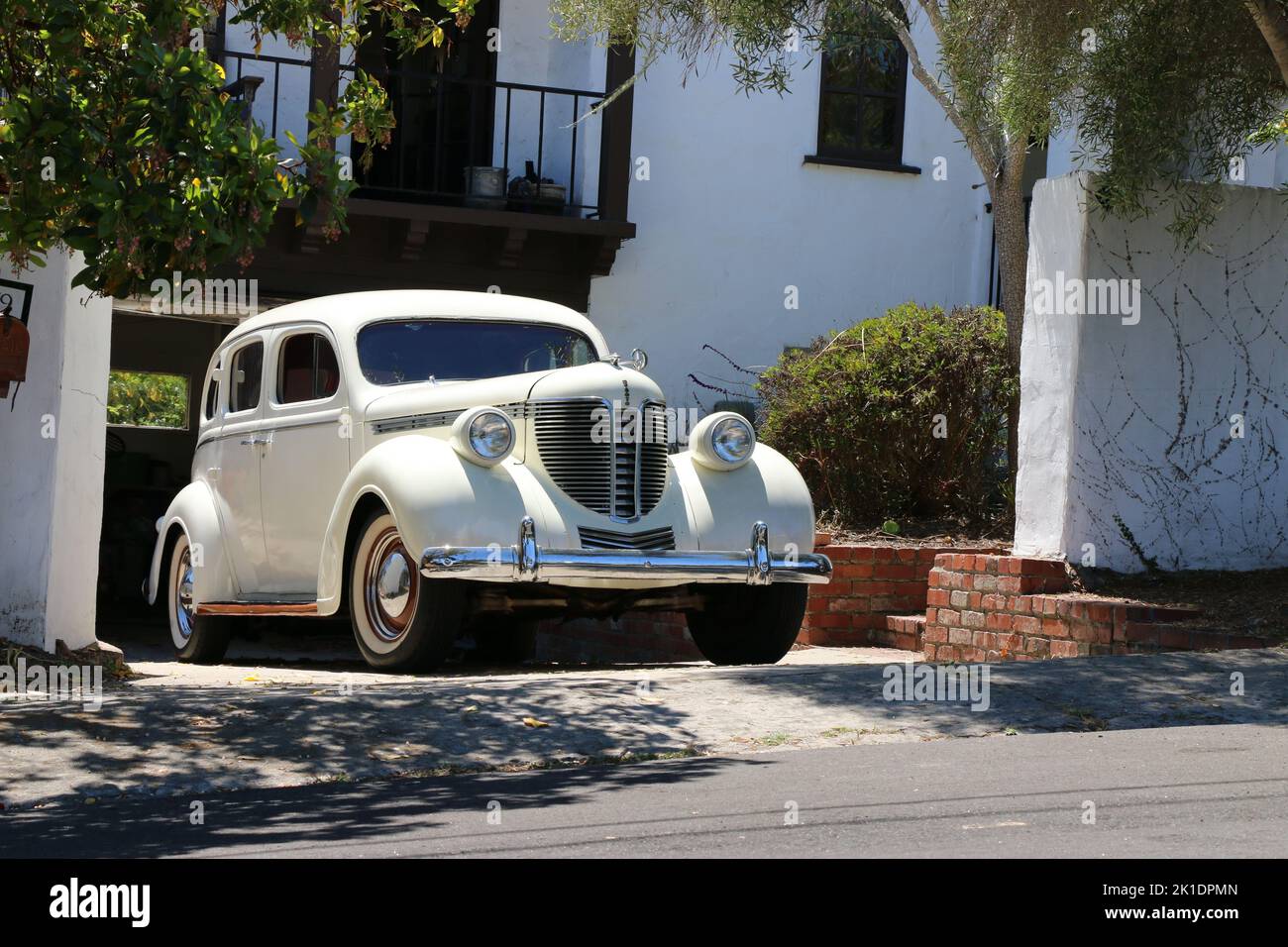 Monterey, CA, USA - 18 Aug 2022: Beautiful, classic cream colored DeSoto in pristine condition is parked in a driveway in Monterey during Classic Car Stock Photo