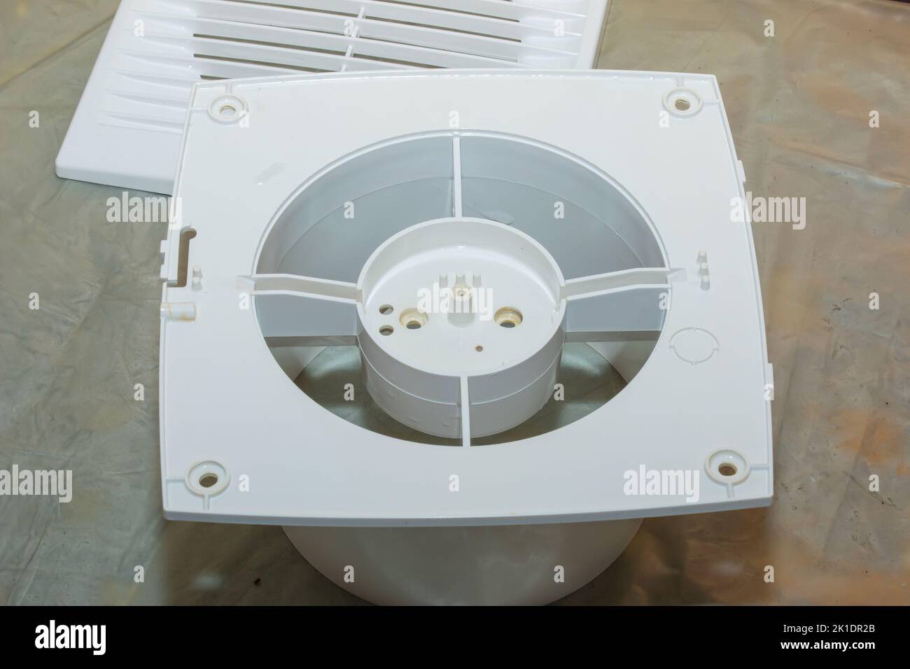 Parts of a kitchen exhaust fan after cleaning and washing. The process of cleaning a very dirty