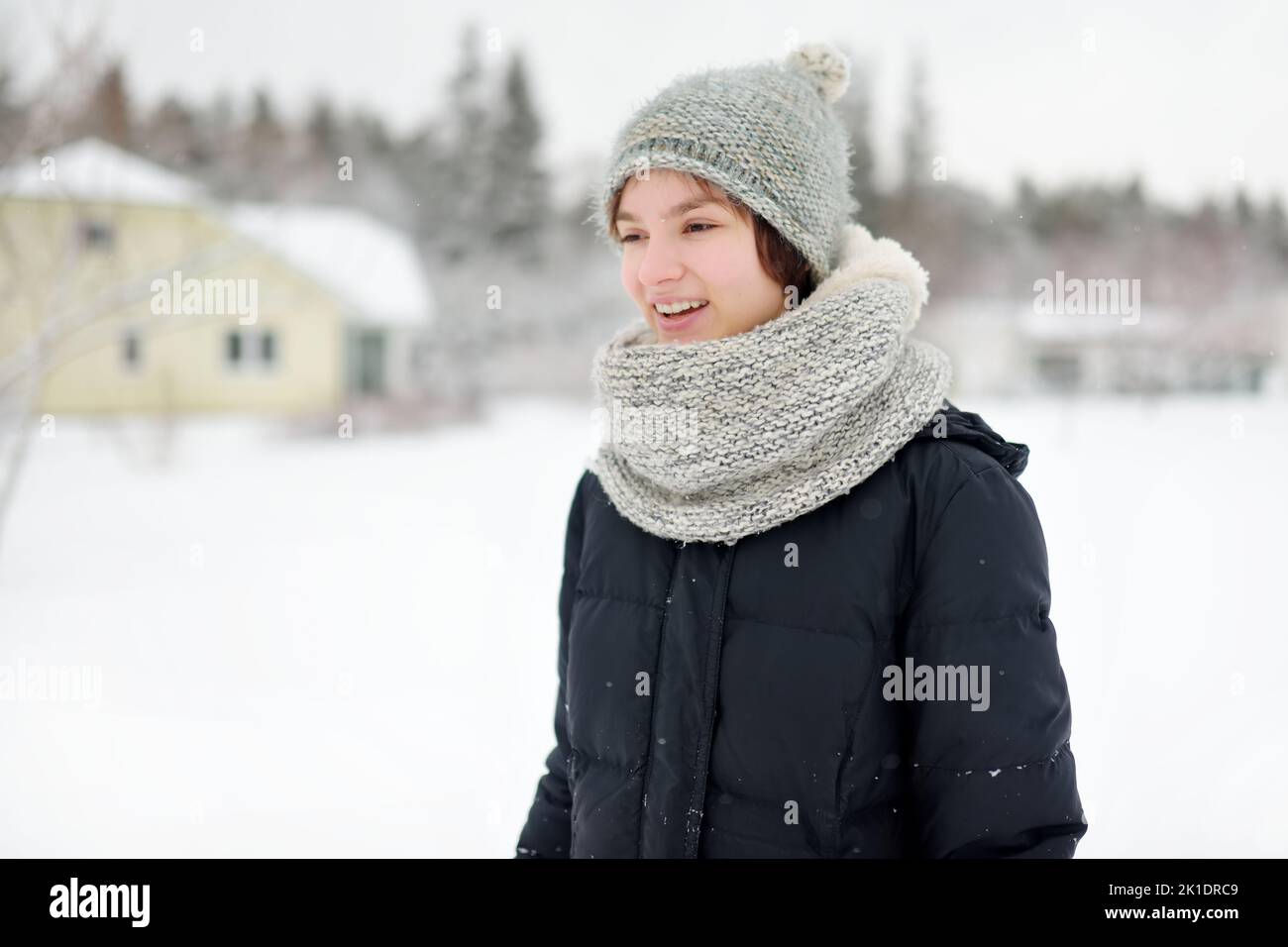 Cute Young Girl Having Fun On A Walk In Snow Covered Park On Chilly cute-young-girl-having-fun-on-a-walk-in-snow-covered-park-on-chilly