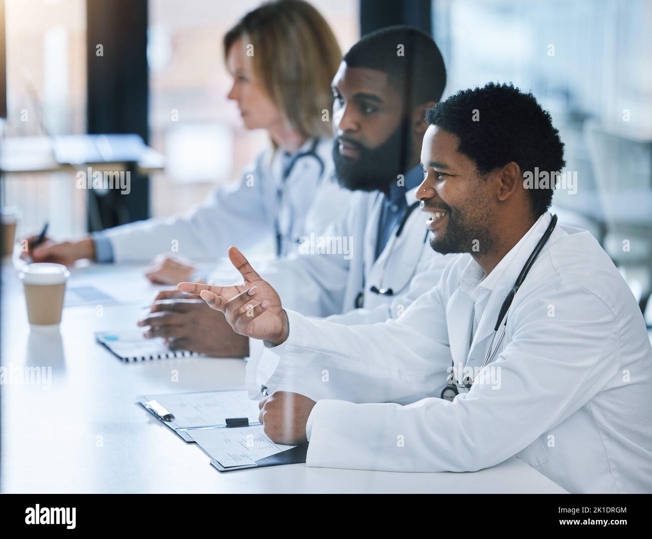 Doctors, healthcare workers and medical expert in meeting at hospital, collaboration on medicine in seminar conference and talking about cardiology in Stock Photo