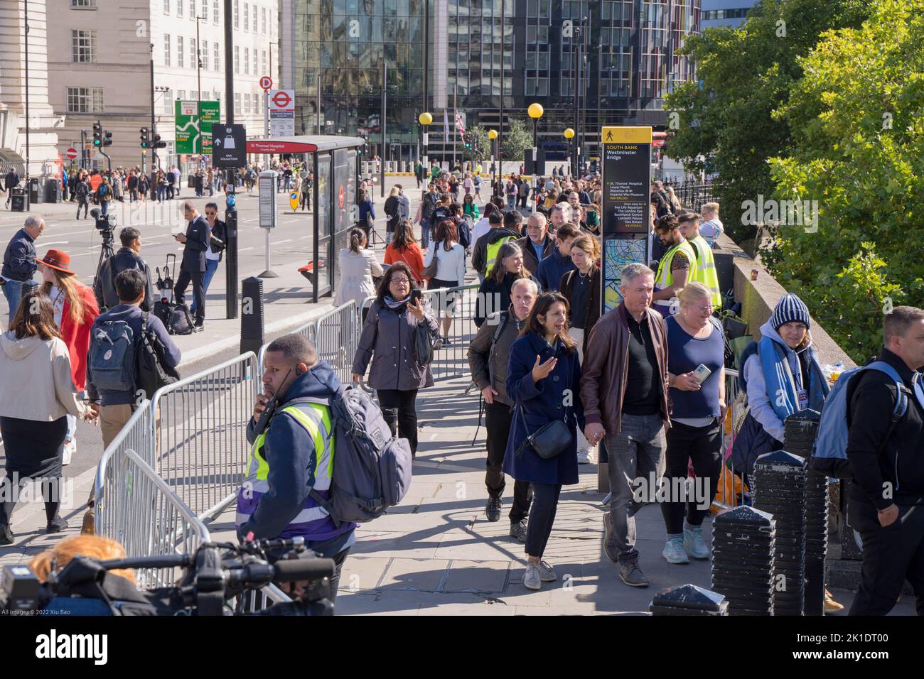 people joining the queues along the south bank of the River Thames to pay their respect to the queen lying-in-state at Westminster hall London UK Stock Photo