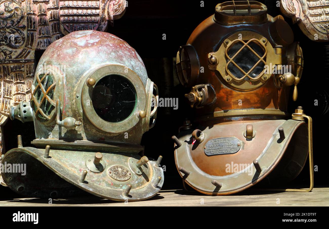 Two old rustic vintage diving helmets Stock Photo