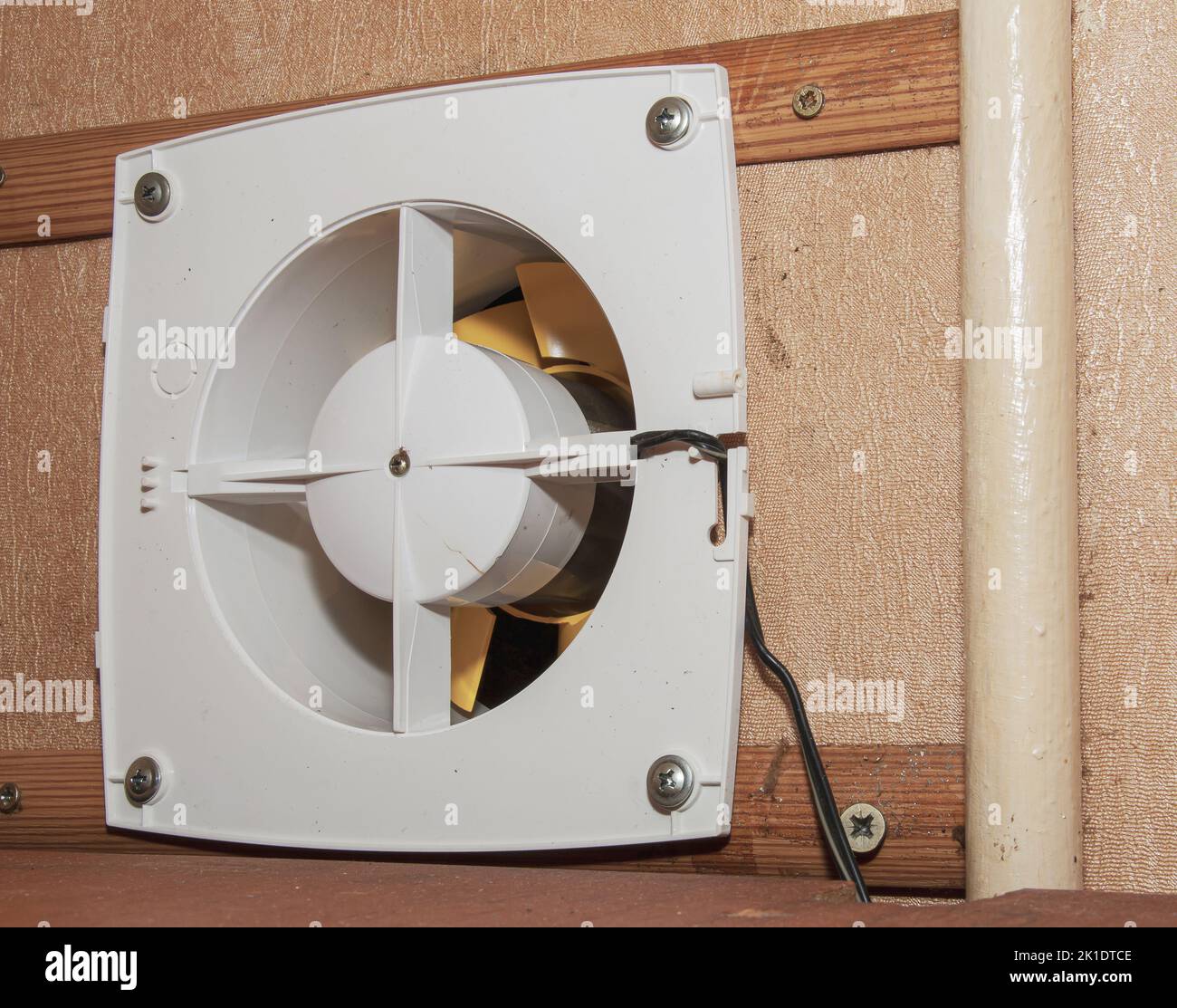 The kitchen exhaust fan after cleaning and washing is installed on the