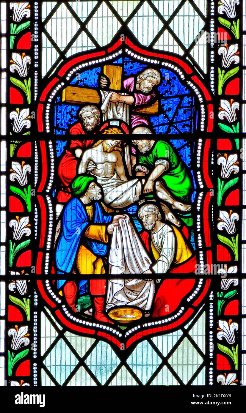 Descent, removal of Jesus from the Cross, stained glass window, 1860, Fakenham, Norfolk, England Stock Photo