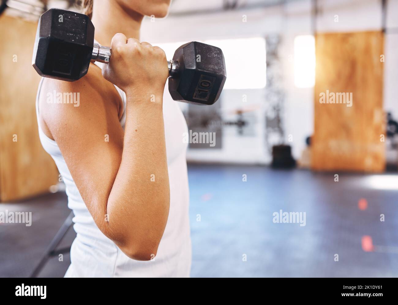 Training, health and weightlifting by woman exercise with a dumbbell at