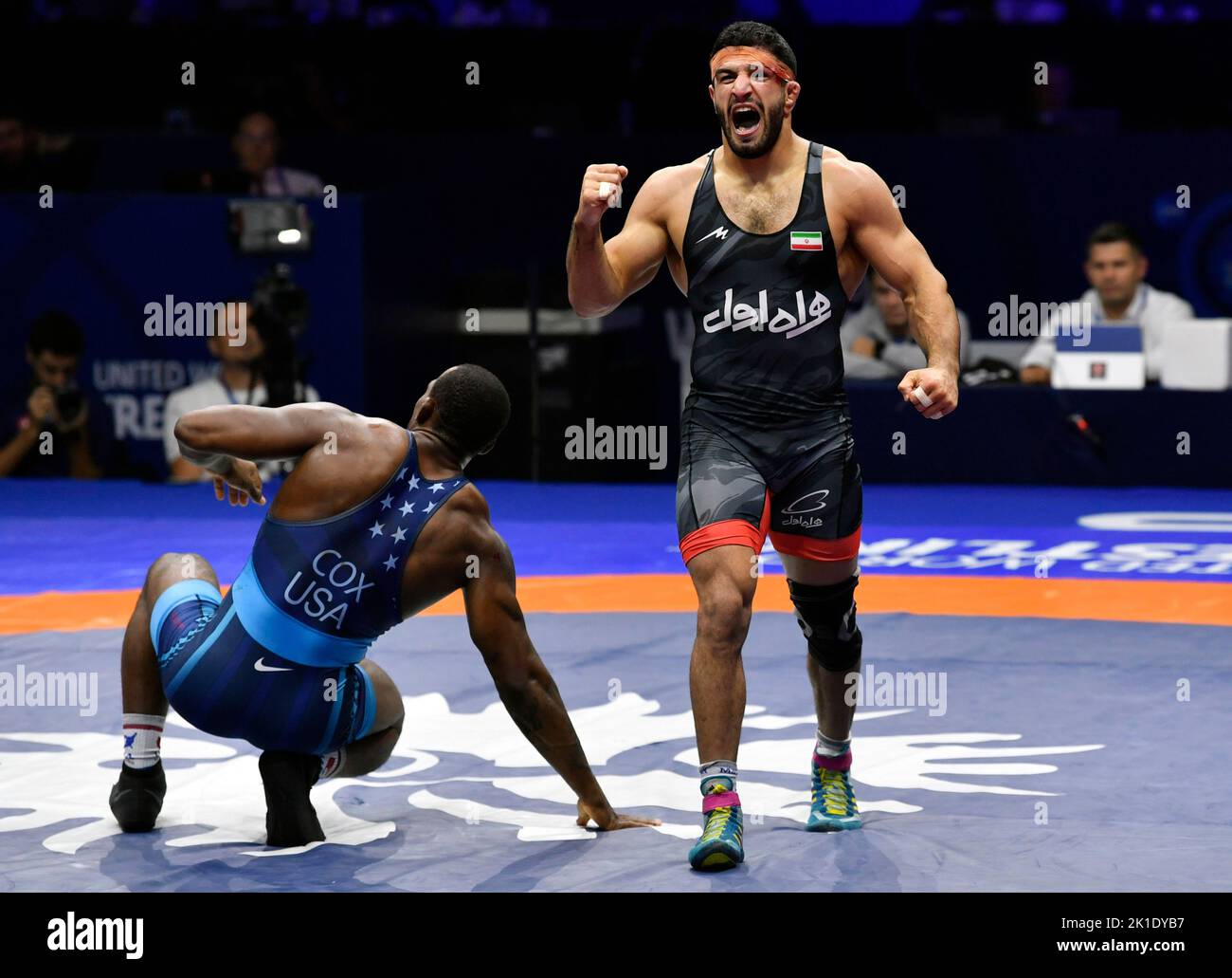 Belgrade. 17th Sep, 2022. Iran's Kamran Ghorban Ghasempour (R) celebrates victory against J'Den Michael Tbory Cox of the United States after the men's 92kg category freestyle final at the Wrestling World Championships in Belgrade, Serbia on Sept. 17, 2022. Credit: Predrag Milosavljevic/Xinhua/Alamy Live News Stock Photo