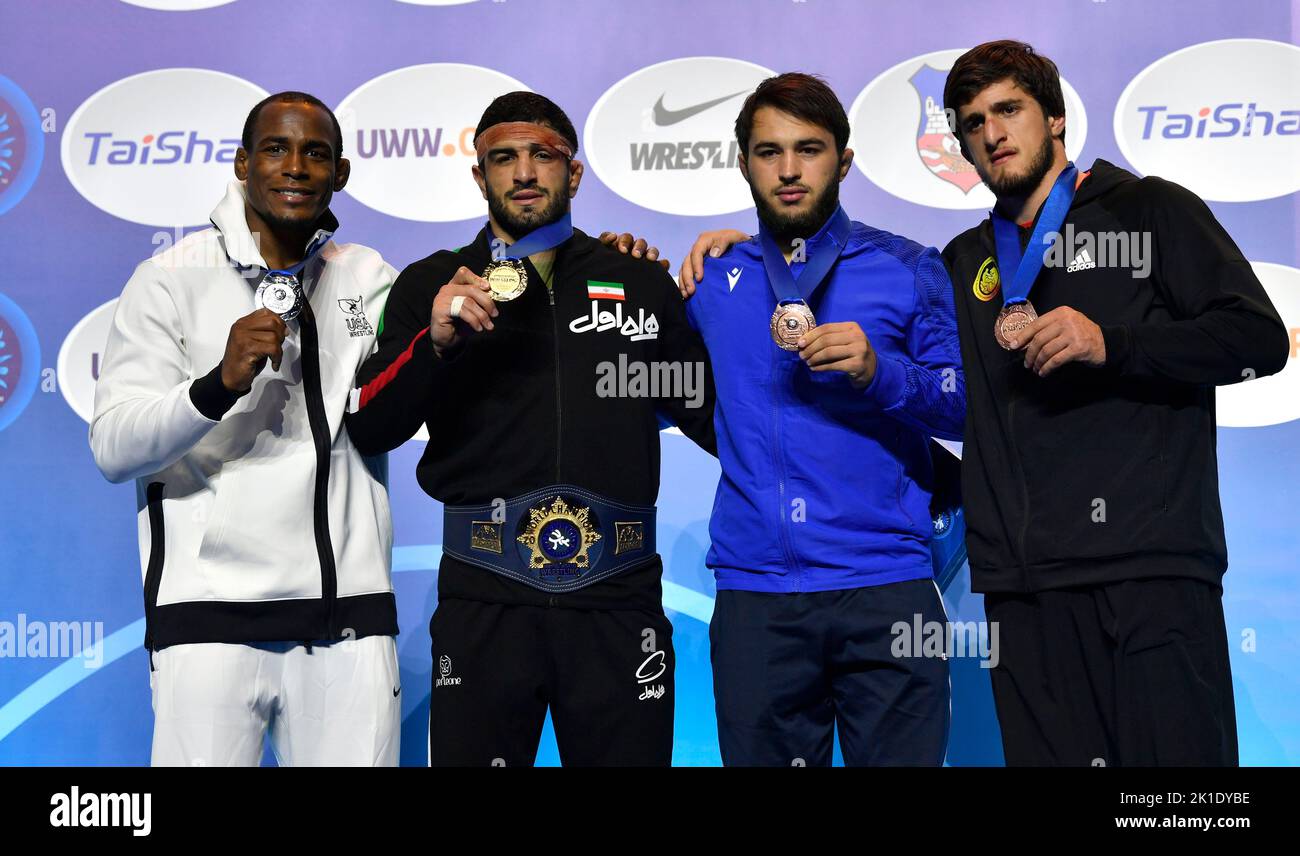 (220918) -- BELGRADE, Sept. 18, 2022 (Xinhua) -- Gold medalist Iran's Kamran Ghorban Ghasempour (2nd L), silver medalist J'Den Michael Tbory Cox (1st L) of the United States, bronze medalists Georgia's Miriani Maisuradze (2nd R) and Azerbaijan's Osman Nurmagomedov pose for photos during the awarding ceremony for the men's 92kg category freestyle event at the Wrestling World Championships in Belgrade, Serbia on Sept. 17, 2022. (Photo by Predrag Milosavljevic/Xinhua) Stock Photo