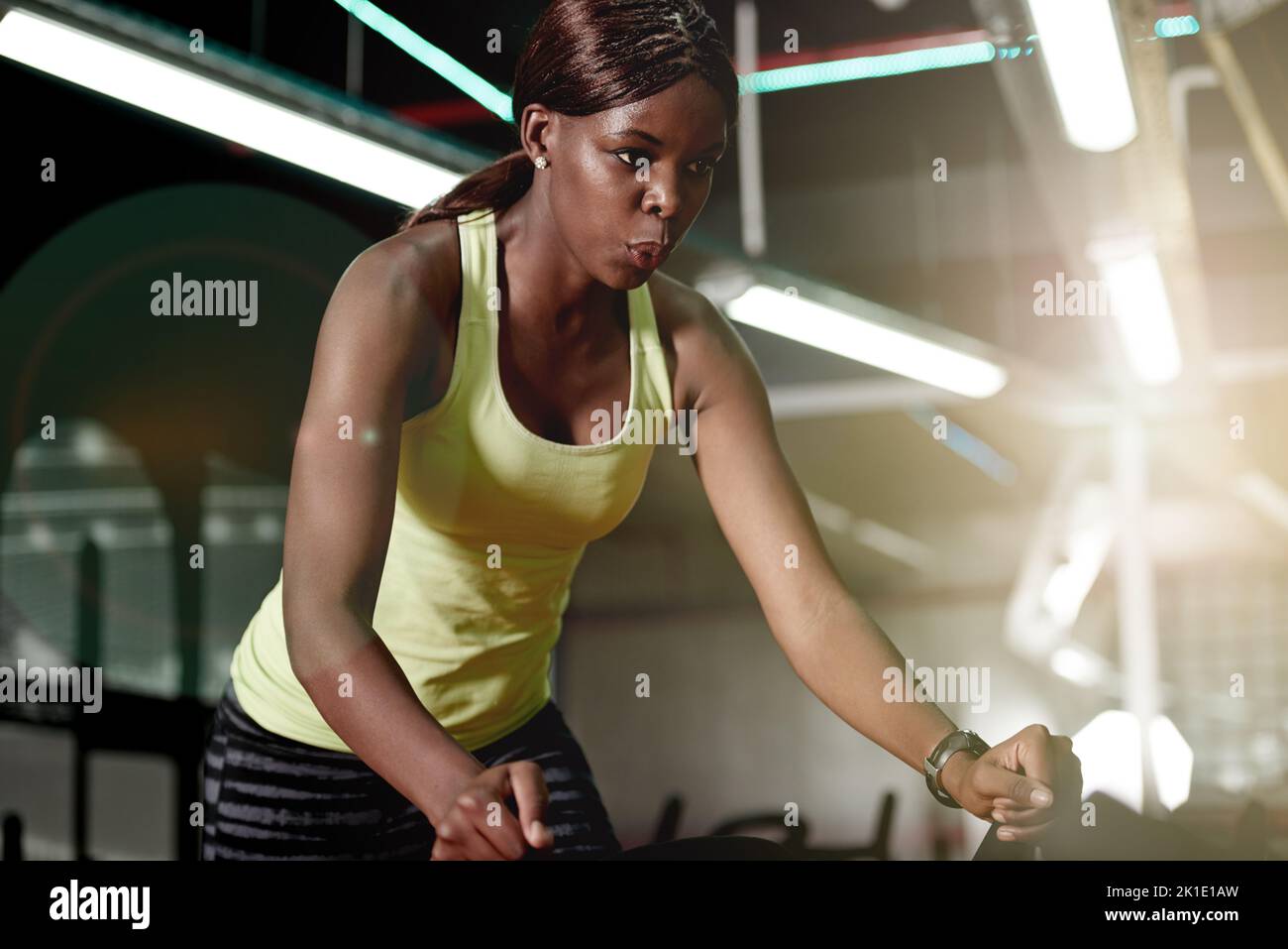 Showing those calories what shes made of. a young woman working out on