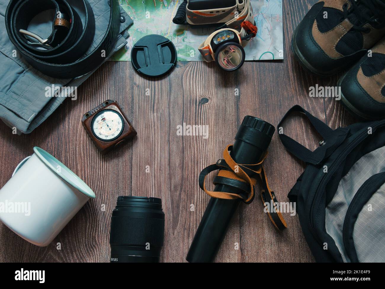 Flat lay of camping gear on a wooden background Stock Photo