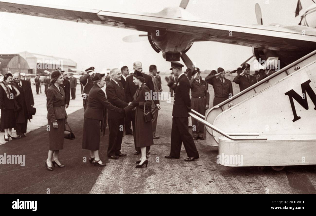 Princess Elizabeth (future Queen Elizabeth II) and Prince Philip, Duke of Edinburgh, are greeted by President Harry S. Truman, his wife, Bess, and his daughter, Margaret, at Washington National Airport in Arlington, Virginia, on October 31, 1951. (USA) Stock Photo