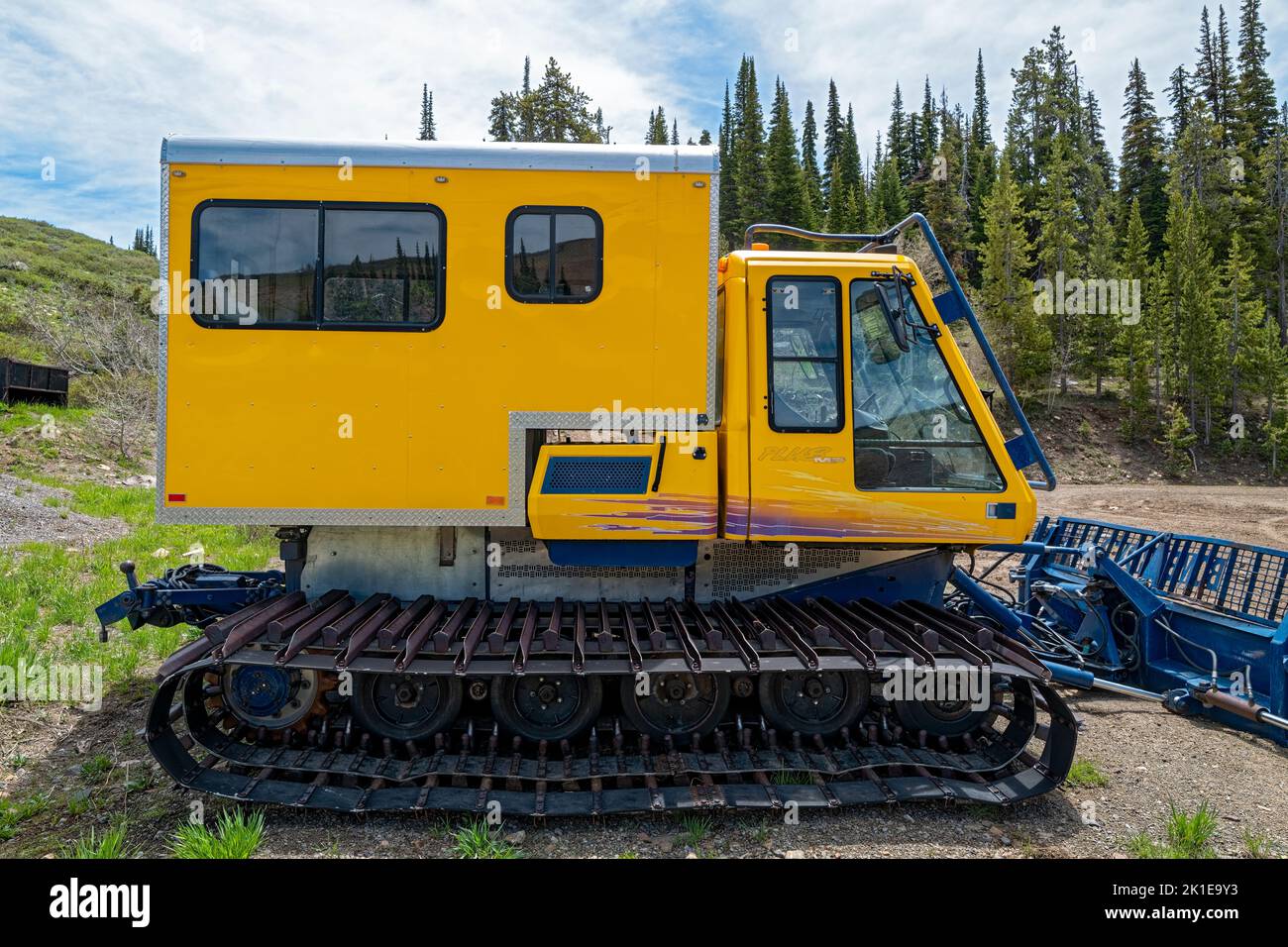 The side of a bombardier Plus MP Snowcat parked at the Pomerelle