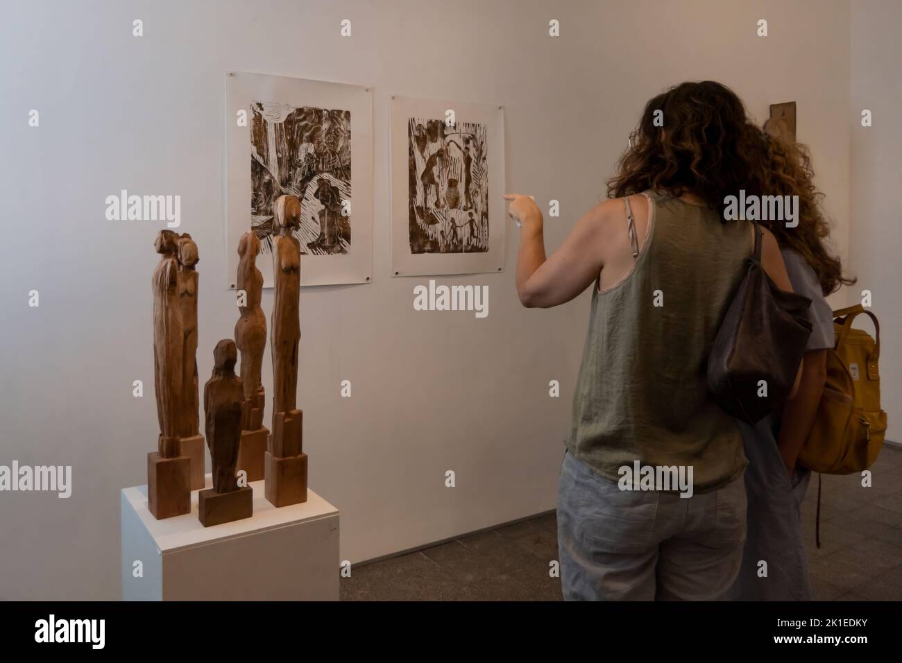 Visitors view artwork by Israeli artist  Guy Saar Ruso during his solo exhibition  entitled 'KOROT' in Maya gallery, in Tel Aviv Israel Stock Photo