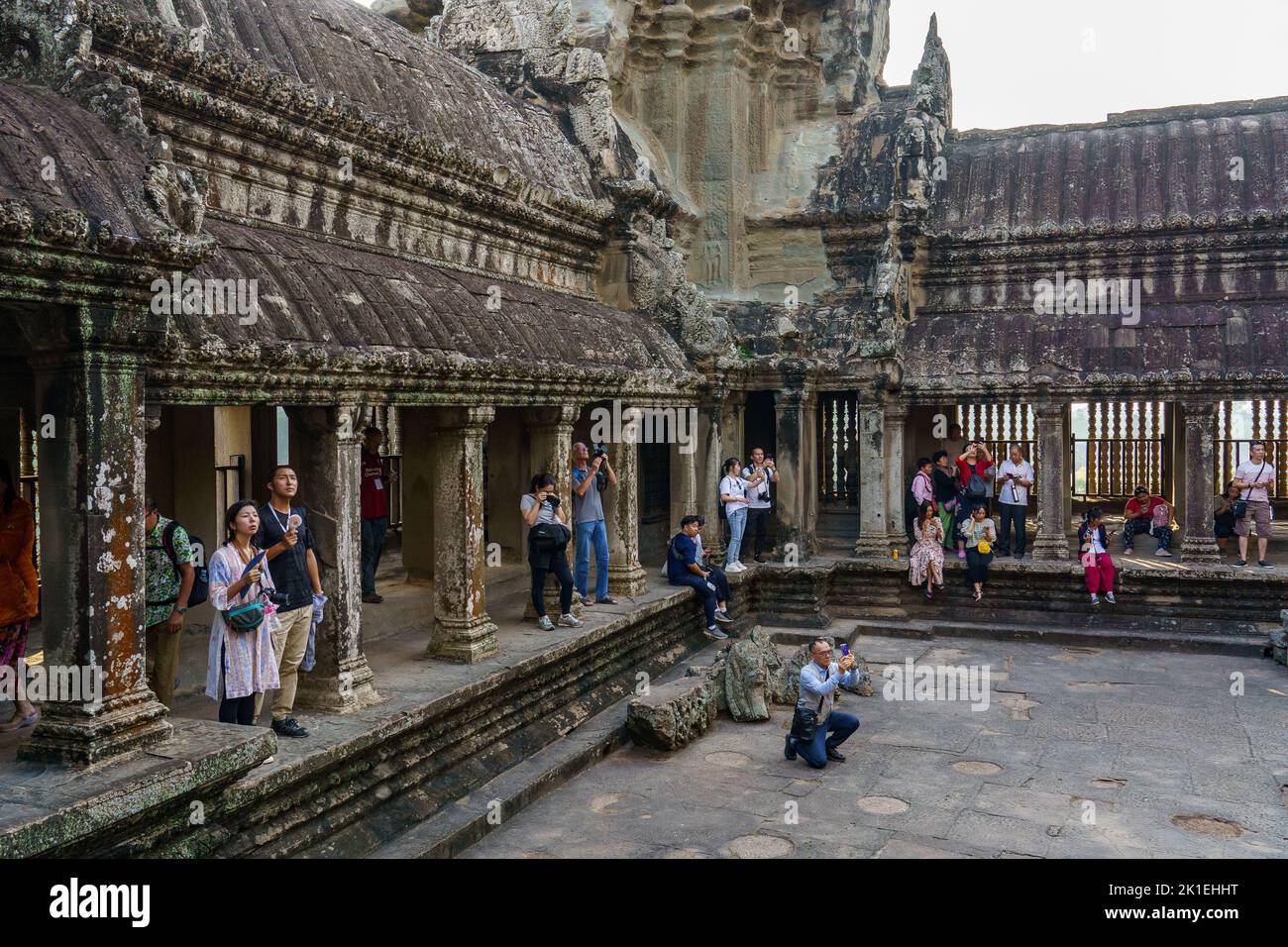 Cambodia. Siem Reap Province. A crowded group of tourists take a photo of Angkor Wat (Temple City), a Buddhist and temple complex in Cambodia Stock Photo