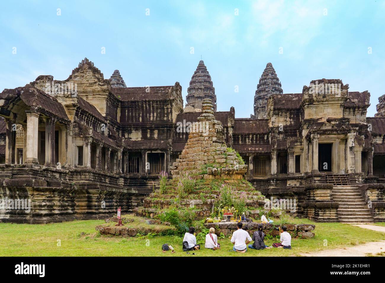 Cambodia. Siem Reap Province. People praying at small temple at Angkor Wat (Temple City). A Buddhist and temple complex in Cambodia Stock Photo