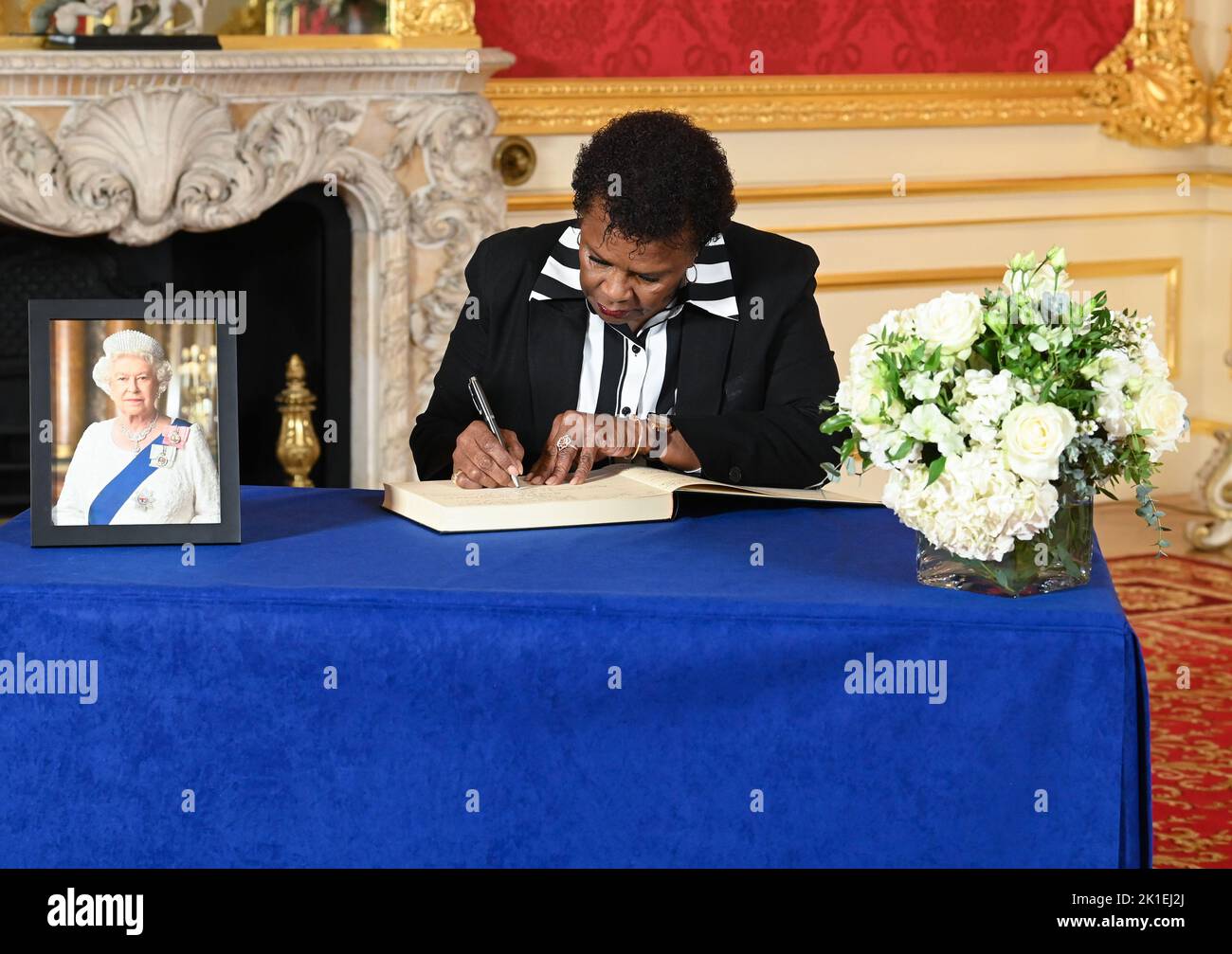 President of Barbados, Sandra Mason, signs a book of condolence at