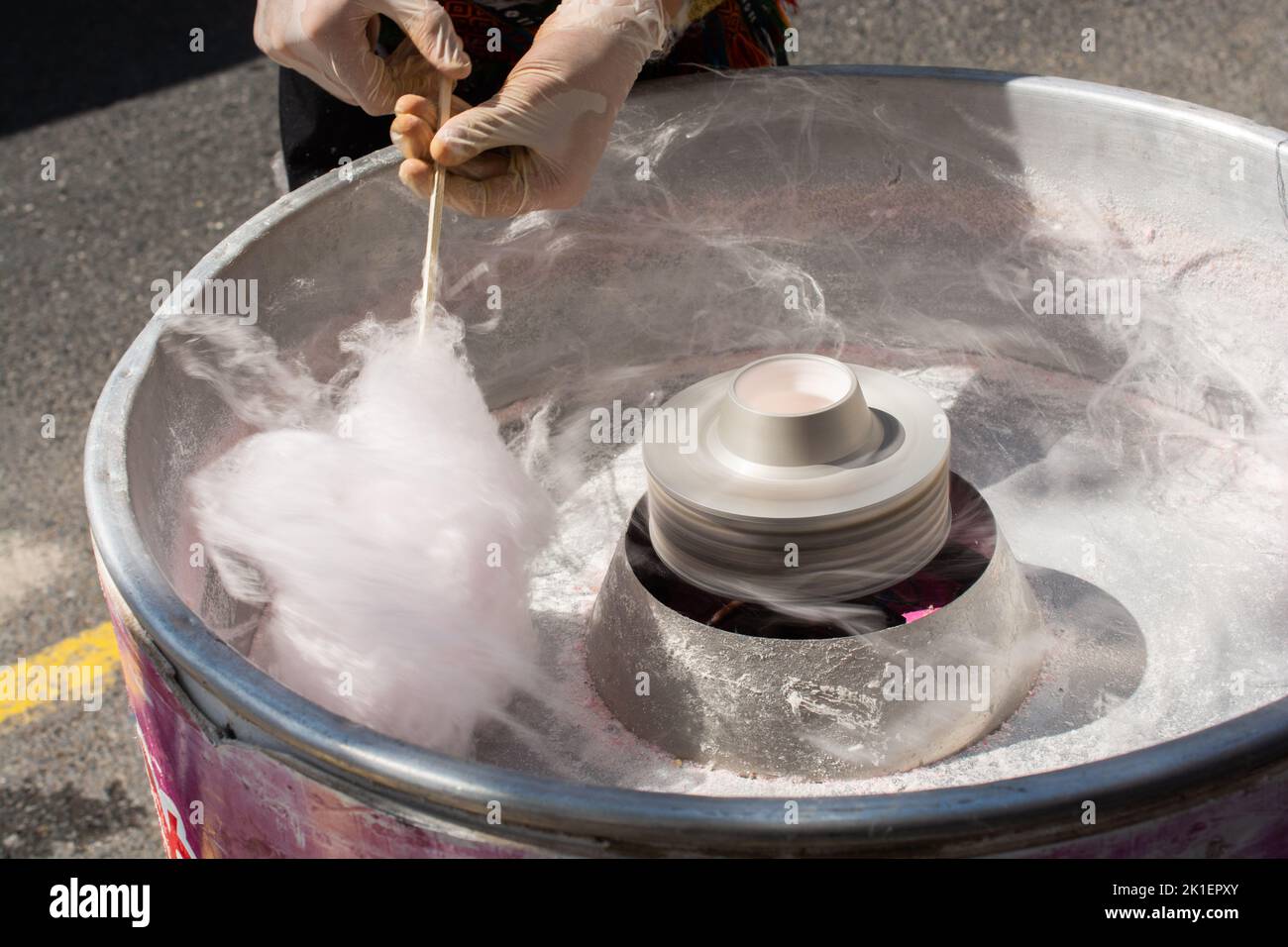 The process of making sweet cotton candy at a street market. Street