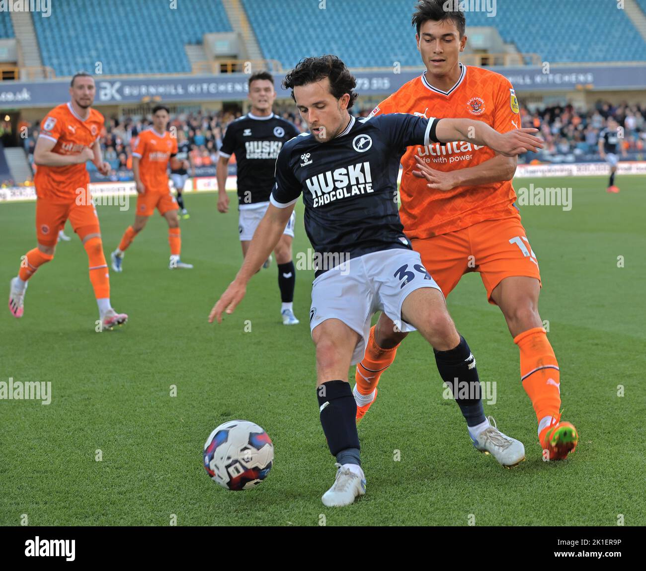 LONDON ENGLAND - SEPTEMBER  17 : L-R George Honeyman of Millwall holds of Kenny Dougall of Blackpool  during Championship match between Millwall again Stock Photo