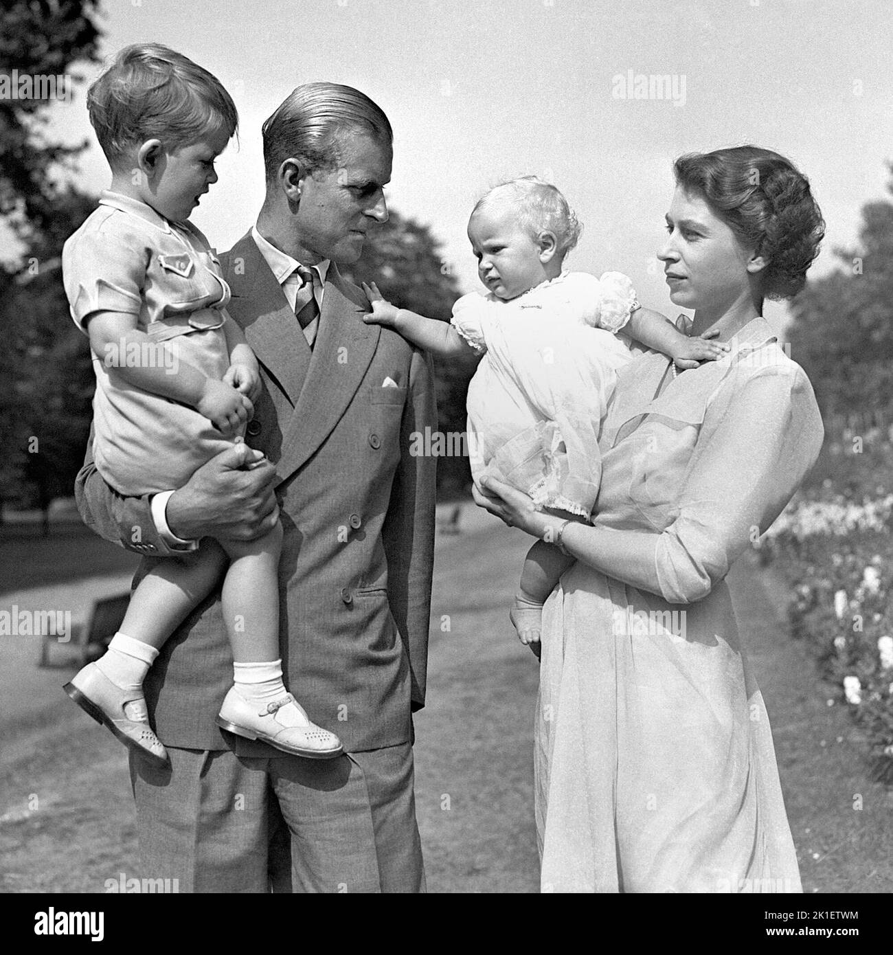 File photo dated 09/08/1951 of Princess Anne in the arms of Princess Elizabeth (now Queen Elizabeth II) with the Duke of Edinburgh, holding Prince Charles, in the grounds of Clarence House, their London residence. Issue date: Sunday September 18, 2022.. Photo credit should read: PA Wire Stock Photo