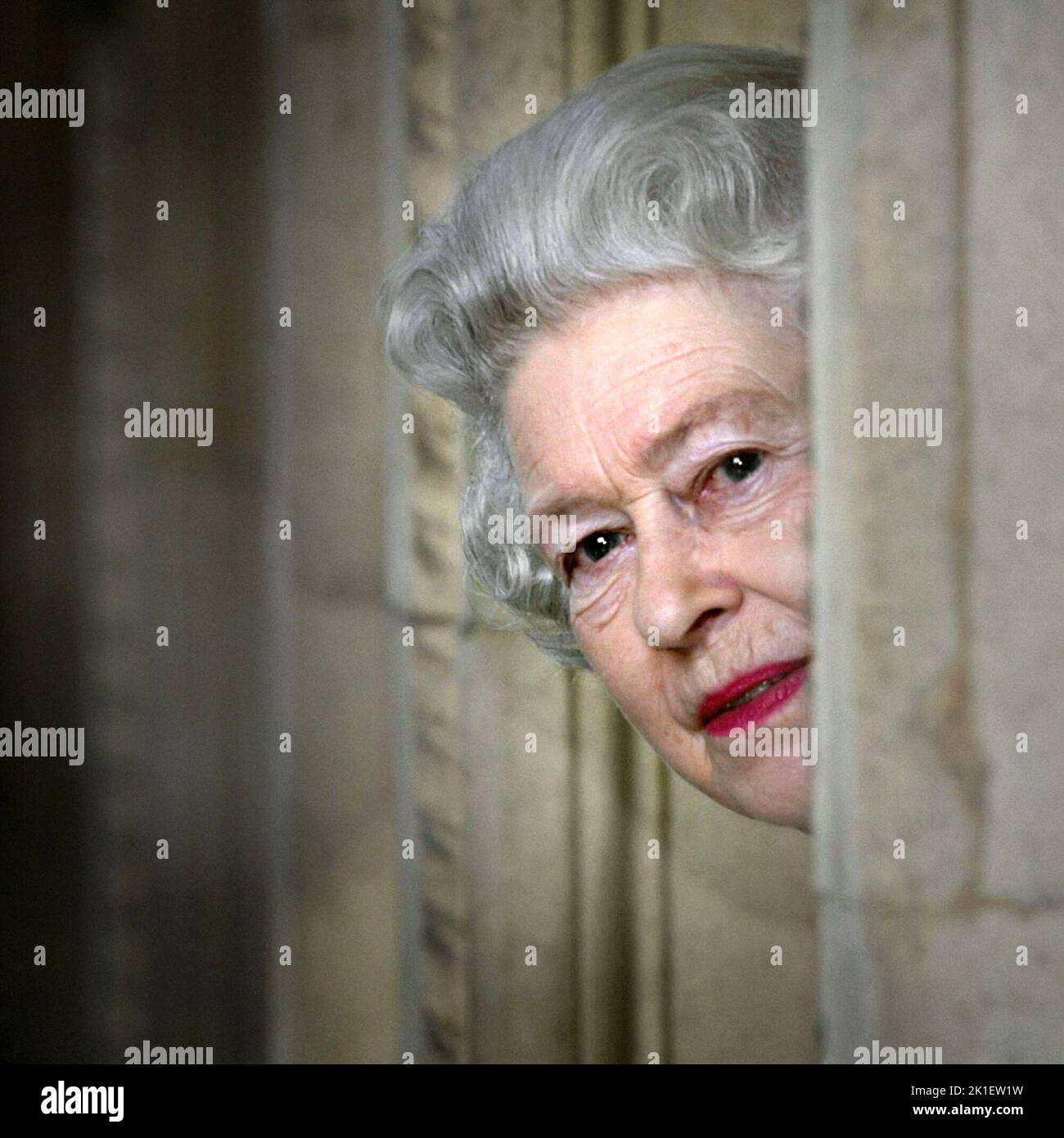 File photo dated 30/03/2004 of Britain's Queen Elizabeth II peers round a corner during a visit to the Royal Albert Hall in London, marking the end of an 8 year restoration program. Issue date: Sunday September 18, 2022.. Photo credit should read: PA Wire Stock Photo
