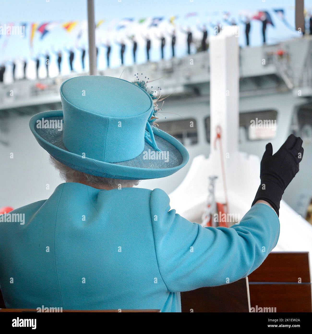 File photo dated 28/11/2015 of Queen Elizabeth II waves to British Royal Navy crew members performing a salute on the HMS Bulwark amphibious assault ship during a tour of the Grand Harbour in Malta. Issue date: Sunday September 18, 2022.. Photo credit should read: Toby Melville/PA Wire Stock Photo