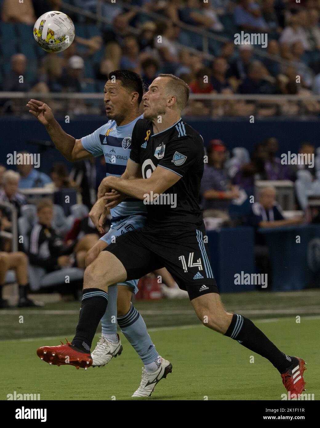 Overland Park, Kansas, USA. 16th Sep, 2022. Minnesota United defender Brent Kallman #14 (f-r) and Sporting KC midfielder Roger Espinoza #15 (b-l) vie for sideline advantage during the second half of the game. (Credit Image: © Serena S.Y. Hsu/ZUMA Press Wire) Stock Photo