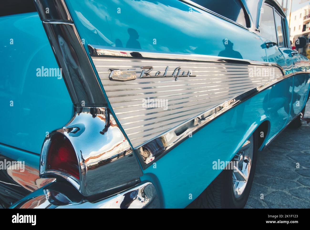 Closeup of the rear side of an aqua marine blue 1957 Chevrolet Bel Air with bullet bumper guards Stock Photo